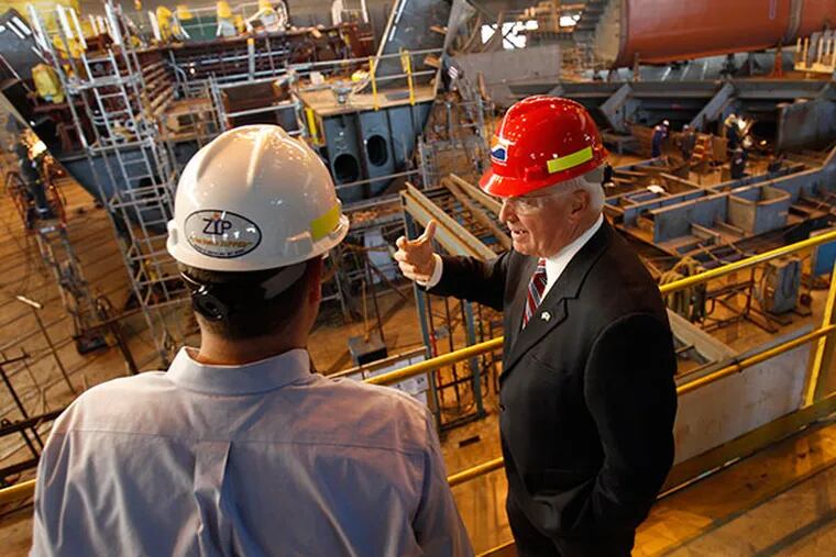 Governor Tom Corbett, right, talks with Scott Clapham, senior vice president at Aker, as he tours the Aker Philadelphia Shipyard in Philadelphia on October 24, 2013. (David Maialetti / Staff Photographer)