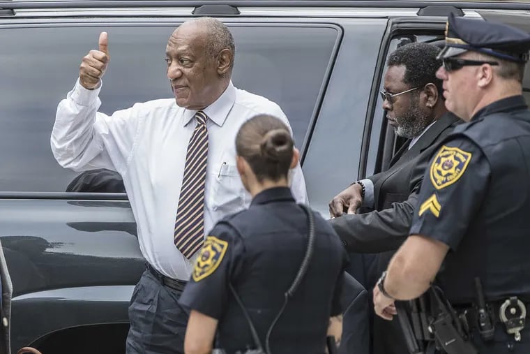 Bill Cosby gives a thumbs up to a fan on the sidewalk as he comes to the Montgomery County Courthouse on Wednesday on the third day of jury deliberation.