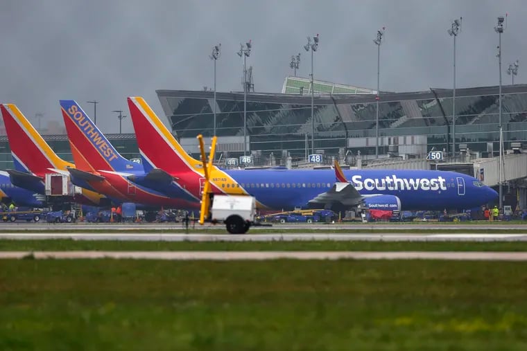 A Boeing 737 Max 8 operated by Southwest Airlines sits at a gate at Hobby Airport in Houston. All 737 Max 8 and 9 aircraft are grounded.