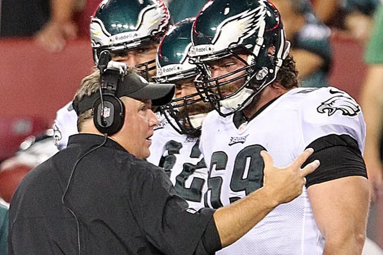 Eagles head coach Chip Kelly and offensive lineman Evan Mathis when both were on the same page. (Yong Kim/Staff Photographer)