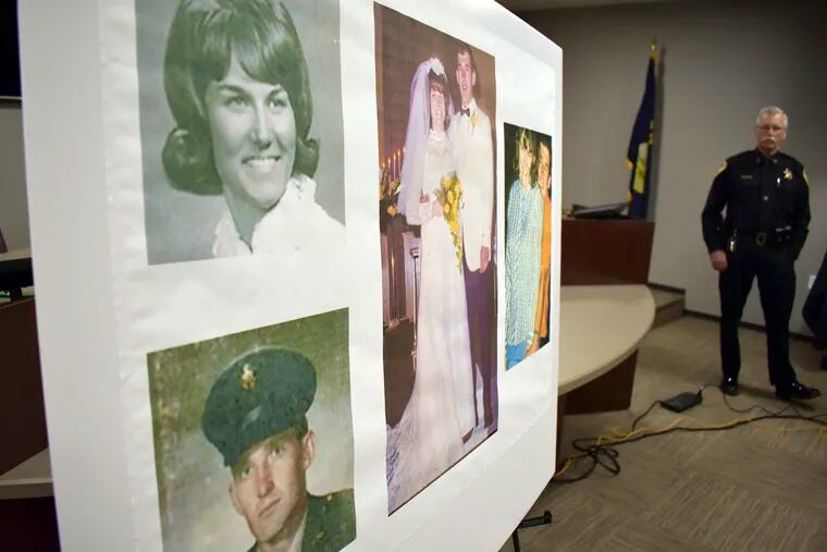 Photos of Linda and Clifford Bernhardt, who were killed in 1973, are displayed at a press conference at the Yellowstone County administrative offices in Billings, Montana on Monday, March 25, 2019. Yellowstone County Sheriff Mike Linder, pictured at right, says authorities have identified the couple's now-deceased killer. (AP Photo/Matthew Brown)