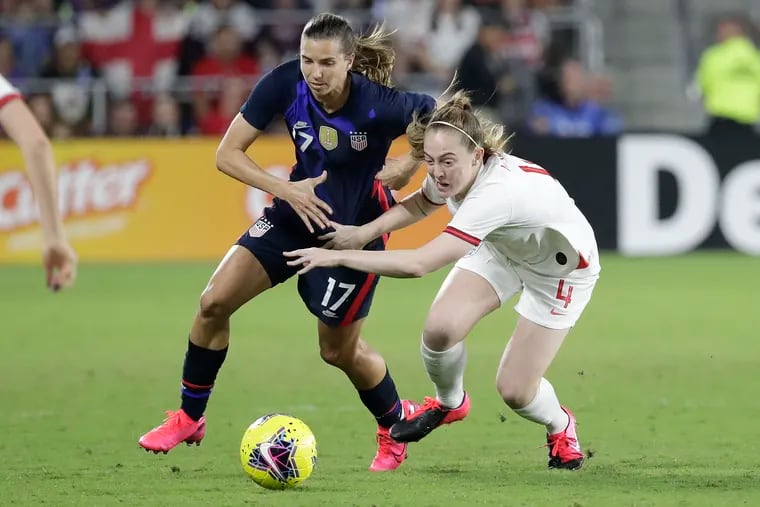 Tobin Heath, left, battling for the ball against England's Kiera Walsh during the teams' SheBelieves Cup game last March.