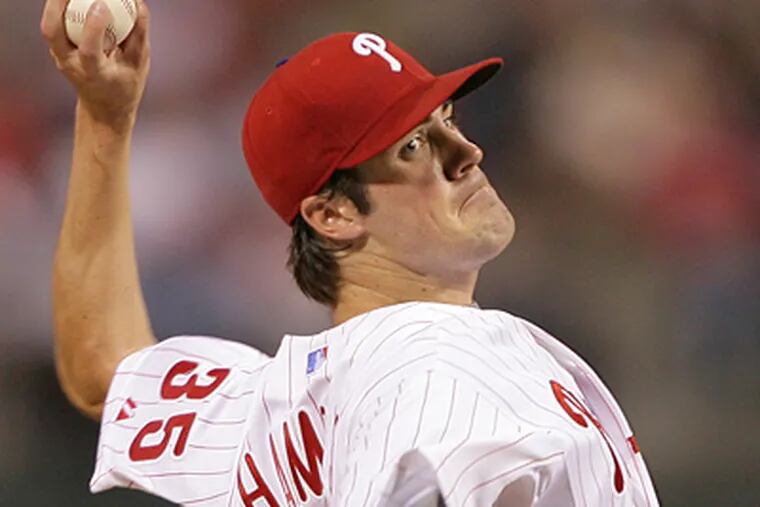 Cole Hamels allowed a career-low four hits and retired 15 batters in a row early in the game en route to a 5-0 shutout of the Braves Thursday night. (Jerry Lodriguss/Inquirer)