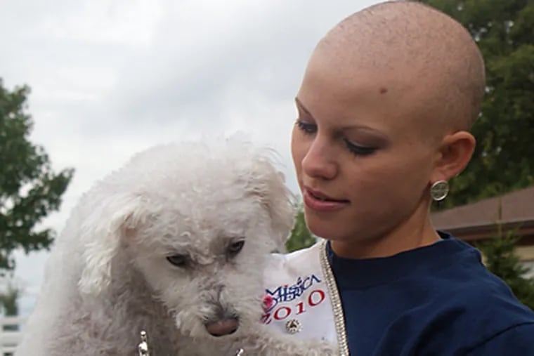 Kayla Martell, the current Miss Delaware, with her dog, Bridgette. She was diagnosed with alopecia areata at age 10. (Katie Pingon)