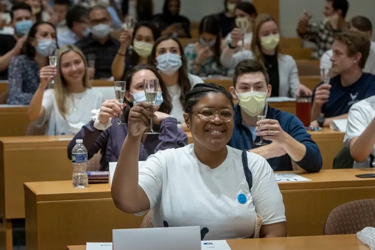 Match Day, when 4th-year medical students learn where they will work as residents after graduation, involves ceremonies such as this March 2022 champagne toast at Thomas Jefferson University's Sidney Kimmel Medical College.