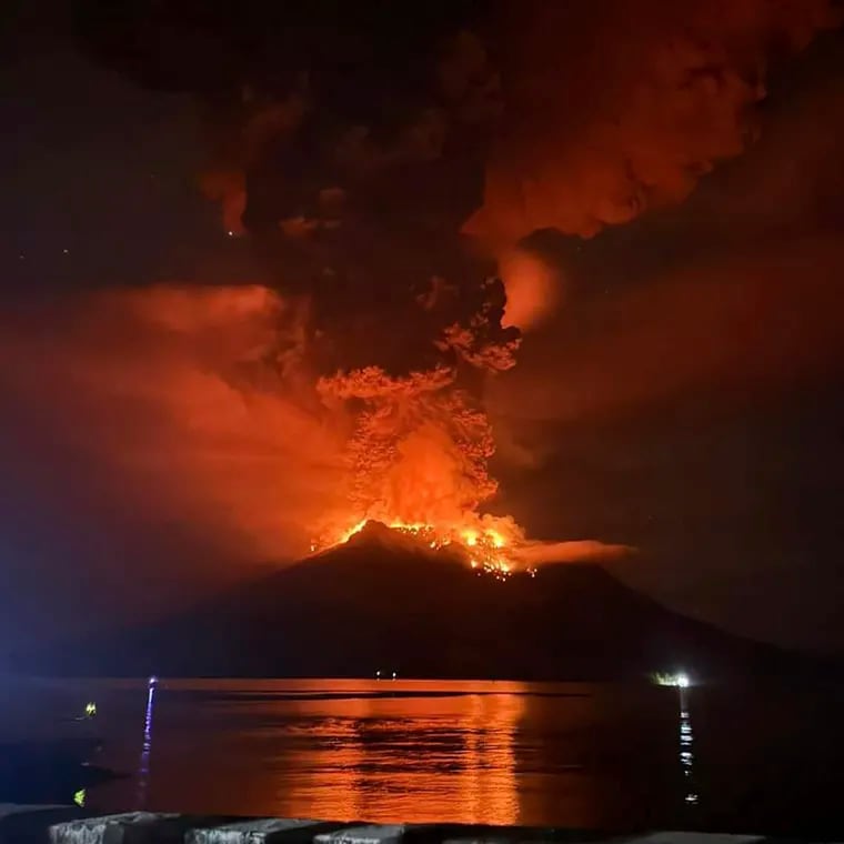 In this photo released by Sitaro Regional Disaster Management Agency (BPBD Sitaro), hot molten lava glows at the crater of Mount Ruang as it erupts in Sanguine Islands, Indonesia, Wednesday, April 17, 2024.