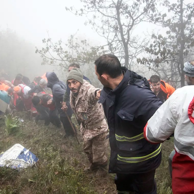 Rescue team members work at the scene of a crash of a helicopter carrying Iranian President Ebrahim Raisi in Varzaghan in northwestern Iran on Monday, May 20, 2024. Raisi, the country’s foreign minister and several other officials were found dead.