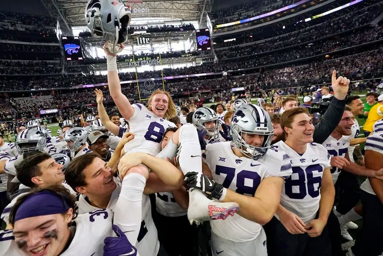 Kansas State's Ty Zentner (8) is lifted up by his teammates after hitting the game winning field goal in overtime of the Big 12 Conference championship NCAA college football game against TCU, Saturday, Dec. 3, 2022, in Arlington, Texas.