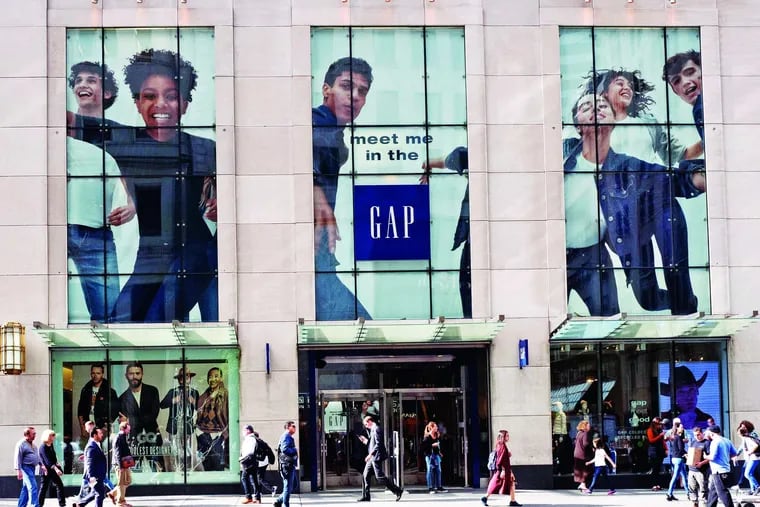 People pass a Gap store on New York's Fifth Avenue. Diversity in the ad industry is becoming a higher priority for consumer-product companies.