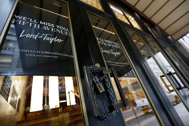 A padlock secures a set of doors on a side entrance to Lord & Taylor's flagship Fifth Avenue store, which closed for good Wednesday, Jan. 2, 2019 in New York.