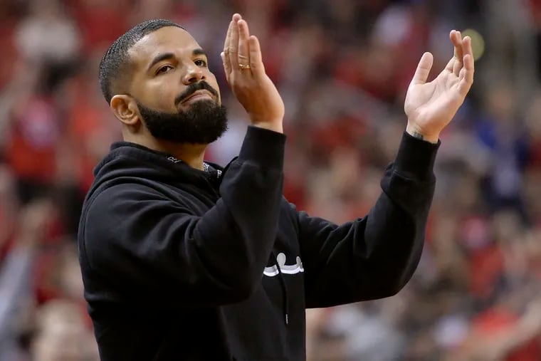 Drake cheers from courtside during the first half of Game 6 of the NBA basketball playoffs Eastern Conference finals between the Toronto Raptors and the Milwaukee Bucks on Saturday, May 25, 2019, in Toronto. (Nathan Denette/The Canadian Press via AP)