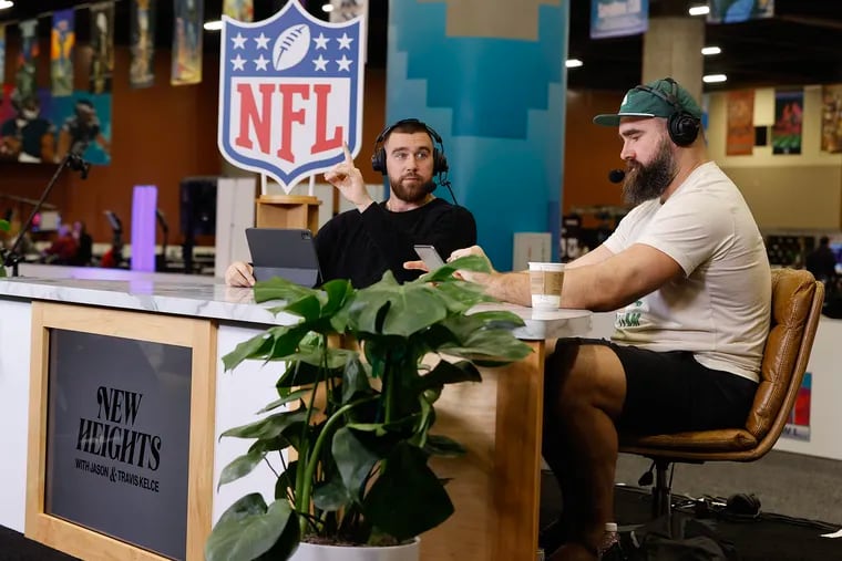 Eagles center Jason Kelce (right) with his brother Kansas City Chiefs tight end Travis Kelce recording their “New Heights with Jason and Travis Kelce,” podcast in Phoenix in February.