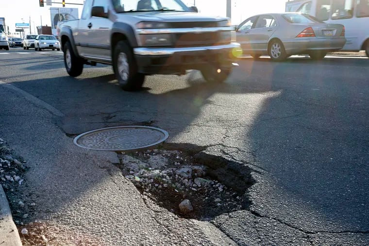 A pothole on South 34th Street near Grays Ferry Avenue in Philadelphia. PennDot is beginning repair work on potholes on state roadways this week.