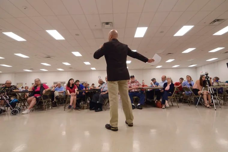 In this May 3, 2018 file photo, Doug Mastriano, one of eight Republicans running for the U.S. House in Pennsylvania's 13th District, speaks to a crowd of party faithful at the Southeastern Adams Volunteer Emergency Services social hall, in Hanover, Pa.