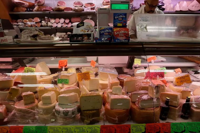 A deli counter in Rome, stocked with a wide range of Italian cheeses. President Trump’s tariffs have hit European cheese, wine and whiskey, and some experts fear cars could be next.