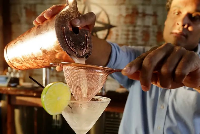 Bartender Anthony Young makes a Delaware Bay Breeze at the Nauti Spirits Distillery in Cape May, NJ.  A new farm-to-bar distillery growing and harvesting sweet potatoes for their flagship vodka,