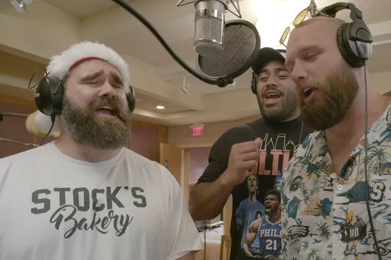 Eagles linemen (from left) Jason Kelce, Jordan Mailata, and Lane Johnson in the studio recording "A Philly Special Christmas Special," the trio's new album of holiday songs to benefit Philadelphia charities which will be released in November.
