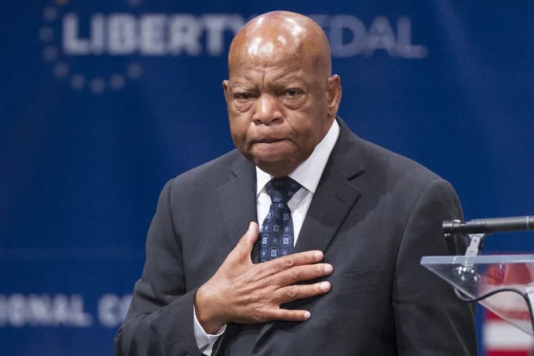 Civil Rights icon, Congressman John Lewis, places his hand over his heart as he faces the crowd.  Lewis received the Liberty Medal at the National Constitution Center on Sept. 19, 2016.