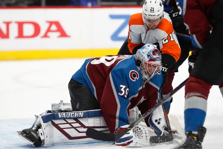 Colorado Avalanche backup goaltender Pavel Francouz covered the puck as the Flyers' Scott Laughton converged during Wednesday's second period.