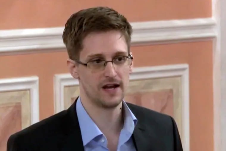 An Oct. 11, 2013 file image made from video and released by WikiLeaks of former National Security Agency systems analyst Edward Snowden speaking in Moscow.