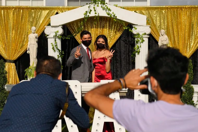 Gabriel Lopez and Delilah Santos have their prom pictures and video taken Saturday, May 16, in front of the home of Diane Scott, a party and event planner in Los Angeles. MTV takes the virtual prom national on Friday, May 22, part of Michelle Obama's daylong event.