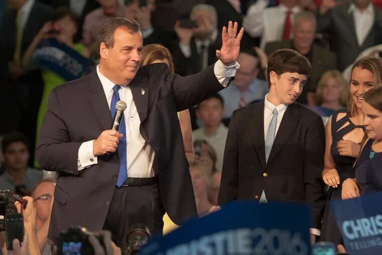 NJ Gov. Chris Christie acknowledges the cheers as he and his family --  wife Mary Pat (behind the Governor) and children (from left) Patrick, Sarah, Bridget (front) and Andrew -- enter the Livingston High School gym, Livingston, NJ, June 30, 2015 where he announced his candidacy for the GOP nomination for President in 2016.  ( CLEM MURRAY / Staff Photographer )