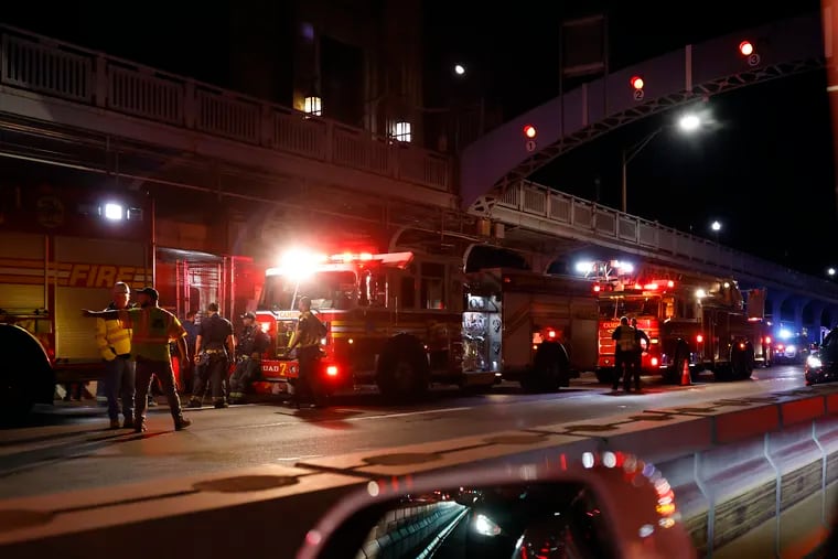 Emergency personnel on the Camden side of the Ben Franklin Bridge where a westbound PATCO train hit and killed two people around 9:20 p.m. on October 14, 2022.