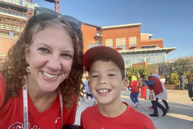 Kristen Graham and son Kieran Goh, 9, outside Citizens Bank Park at Game 4 of the National League Championship Series.