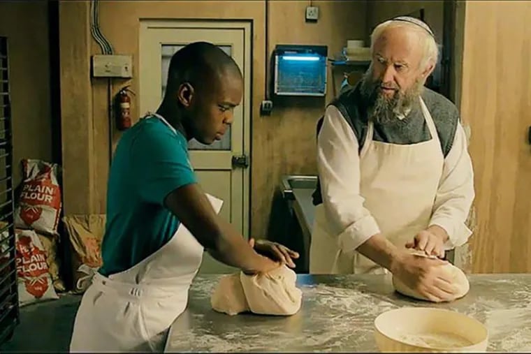 In "Dough," Jerome Holder is an immigrant pot seller apprenticing with Jonathan Pryce, a Jewish baker in London.