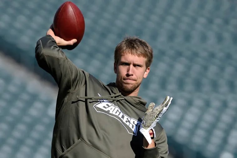 Nick Foles warms up before an NFL football game against the Washington Redskins in Philadelphia, Sunday, Nov. 17, 2013. (Michael Perez/AP)