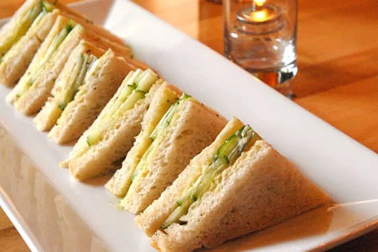 Cucumber sandwiches are a tasty, if dainty, homage to the comfort food of an owner's childhood home in Ireland. (APRIL SAUL / Staff Photographer)