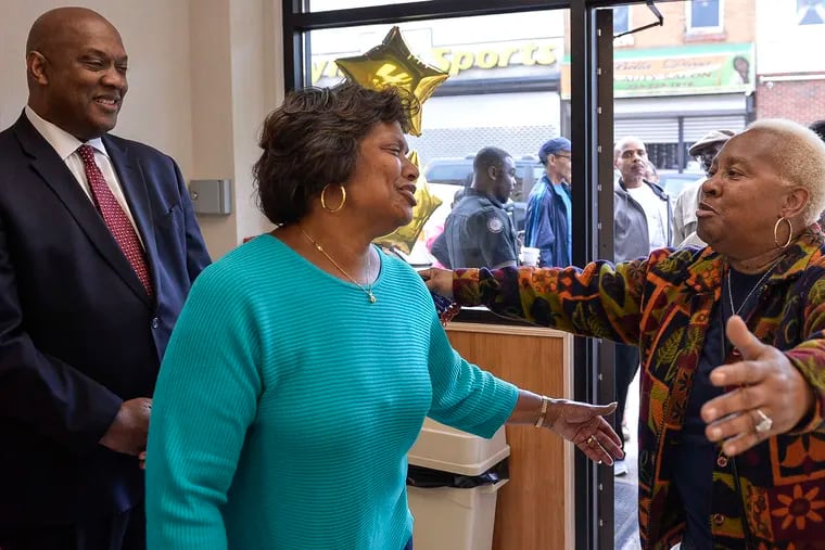 Owner Denise Gause (above left) is greeted by longtime customer Cassandra Tart during the bakery's reopening. Customers didn't mind the wait for Denise's sweets.