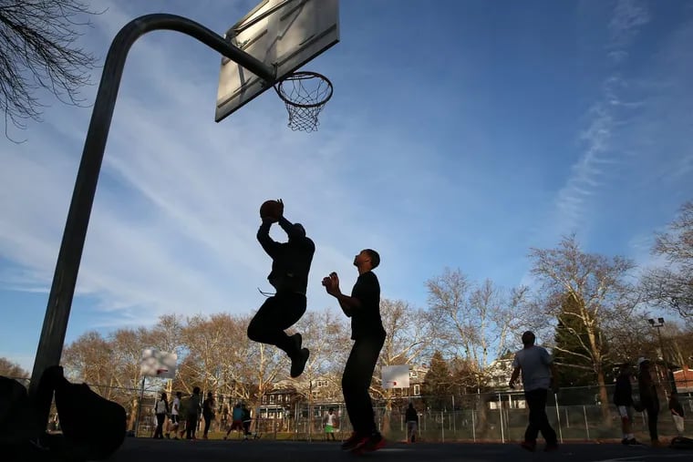 From left, Erick Ortiz, Christian Lozada and Winiel Cruz play basketball at the 11th and Pike Playground in Reading on Tuesday, Nov. 21, 2017. Former Reading Senior High School basketball star Lonnie Walker returns home Wednesday when his team, Miami, takes on La Salle at Santander Arena.