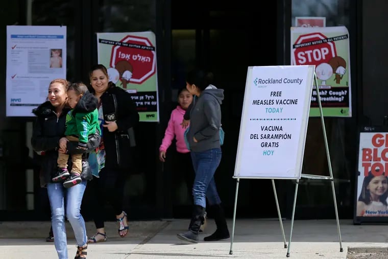 Sign advertising free measles vaccines and information about measles are displayed at the Rockland County Health Department in Pomona, N.Y., Wednesday, March 27, 2019. The county in New York City's northern suburbs declared a local state of emergency Tuesday over a measles outbreak that has infected more than 150 people since last fall, hoping a ban against unvaccinated children in public places wakes their parents to the seriousness of the problem.