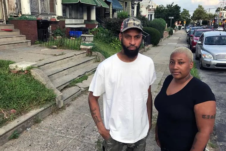 Steve and Tanisha Thomas in front of the home that Tanisha can’t bear to live in following the death of her son.