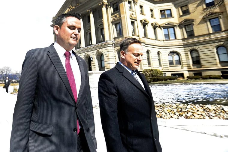 State Represenative Nick Miccarelli (R., Delaware), left, leaves the Luzerne County Courthouse in Wilkes-Barre on Thursday.
