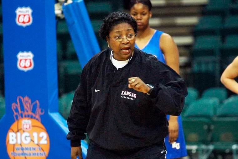 In this March 10, 2003, file photo, Kansas head coach Marian Washington talks to her players during a practice session for the Women's Big 12 basketball tournament in Dallas.