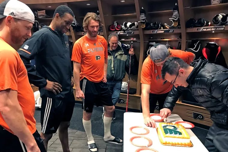 Jackie Lithgow (right), who has survived six brain operations after being injured while breaking up a fight at Bloomsburg University in 2014, turned 23 on Wednesday and was serenaded with Happy Birthday from Flyers (left to right) Claude Giroux, Wayne Simmonds, Sean Couturier, and Jake Voracek in the teamâ€™s locker room in Voorhees.