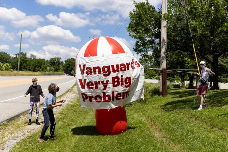 Demonstrators organized by the Sunrise Project and others gather at Cedar Hollow Park to rally and march to Vanguard’s Malvern headquarters to call for Vanguard to take action on climate matters on Thursday, June 24, 2021.