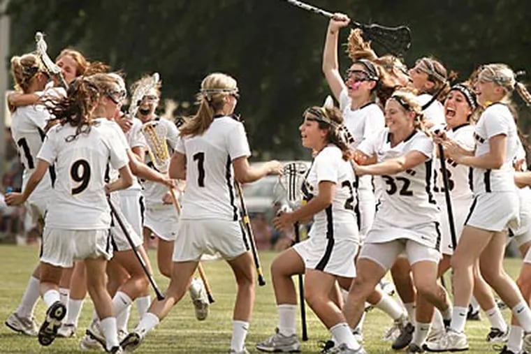 Moorestown players celebrate seconds after the end of the S.J. Group 3 lacrosse final. (Elizabeth Robertson/Staff Photographer)