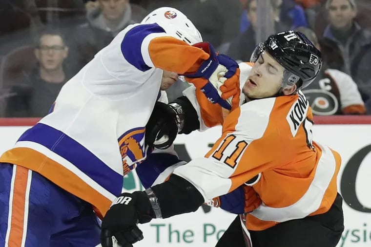 Flyers winger Travis Konecny getting hit by Islanders defenseman Thomas Hickey in a Jan. 4 game won by Philadelphia, 6-4. Konecny has 20 goals in his last 39 games.