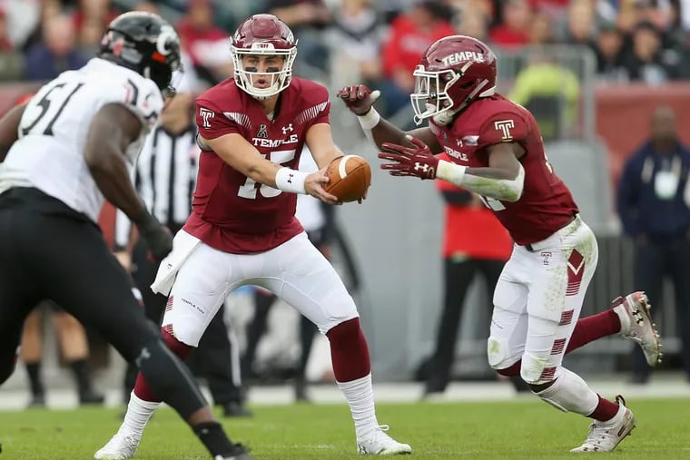 Temple quarterback Anthony Russo (15) hands the ball off to Temple running back Jager Gardner (21) during a game against Cincinnati at Lincoln Financial Field in South Philadelphia on Saturday, Oct. 20, 2018. TIM TAI / Staff Photographer
