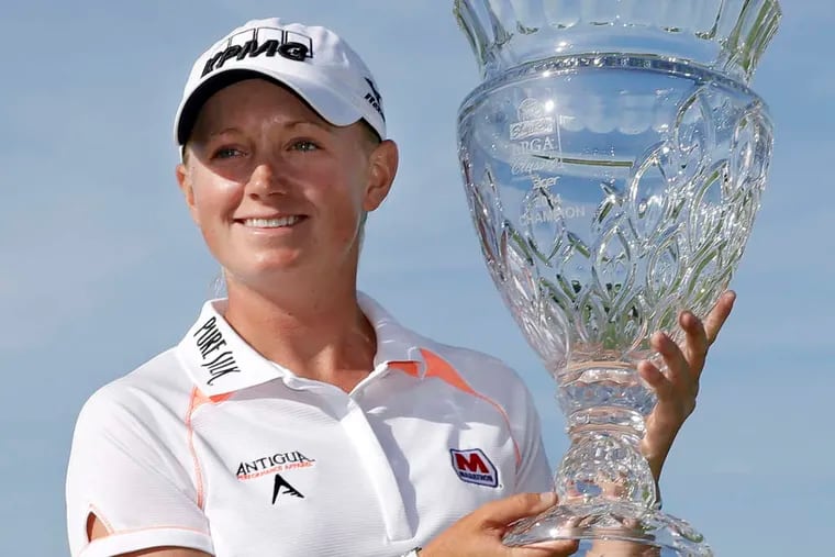 Stacy Lewis holds the championship trophy after winning the 2014 ShopRite LPGA Classic.