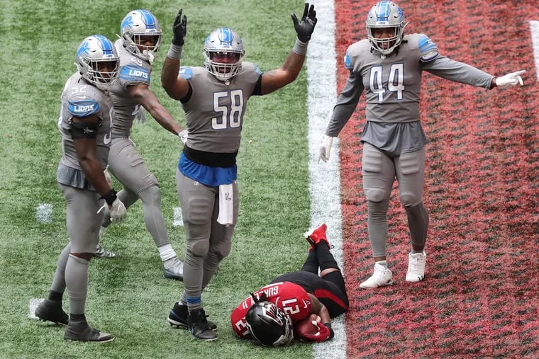 You're seeing this correctly. Detroit linebacker Jamie Collins (58) signals touchdown after Atlanta running back Todd Gurley (21) failed to stop short of the end zone to control the final minute of the clock in the fourth quarter. The Lions rallied to win, 23-22.