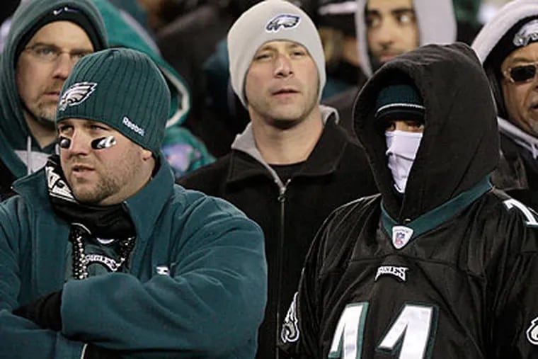 Eagles fans were left dejected after the Birds were knocked out of the playoffs by the Packers. (Yong Kim/Staff Photographer)