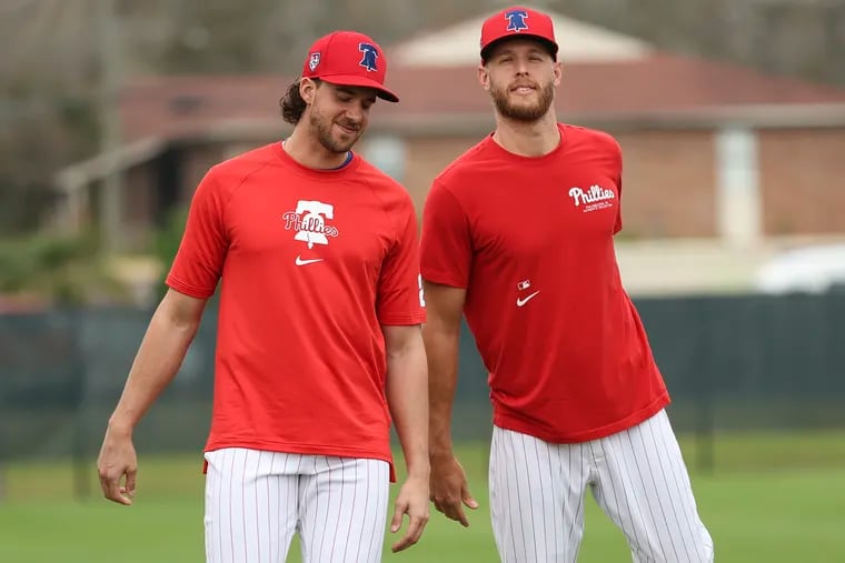Zack Wheeler, right, with co-ace Aaron Nola, left, says Phillies pitchers have been talking a lot about the rash of pitching injuries across the game this season.