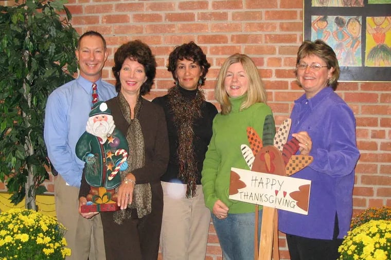 Principal William Bennett, far left, poses with craft show supporters prior to a craft show at Indian Lane Elementary School in Media, Pa. (File photo)