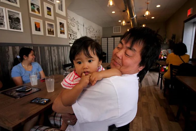 A young customer on the opening day at D’Jakarta, 1540 W. Ritner St.