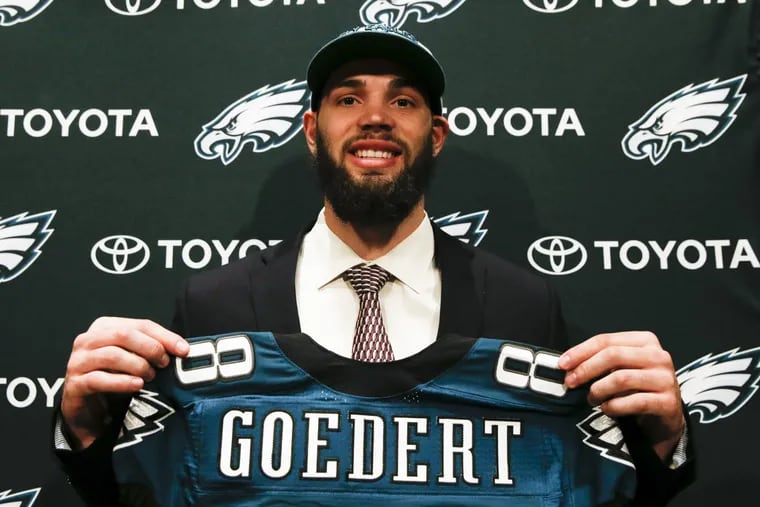 Eagles draft pick TE Dallas Goedert, from South Dakota State, smiles while holding his jersey before meeting with the local media on Saturday, April 28, 2018 at the NovaCare Complex in South Philadelphia.