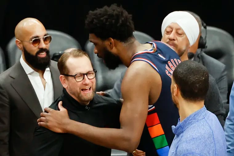 Sixers center Joel Embiid speaks with Toronto Raptors head coach Nick Nurse after the Sixers won a first-round playoff series.